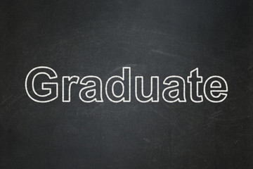 Learning concept: text Graduate on Black chalkboard background