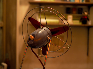 Closeup of small size classic fan from behind.