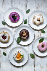 Yummy colorful doughnuts on white board