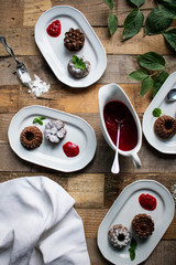 Mini bundt cake with raspberry sauce served on plates