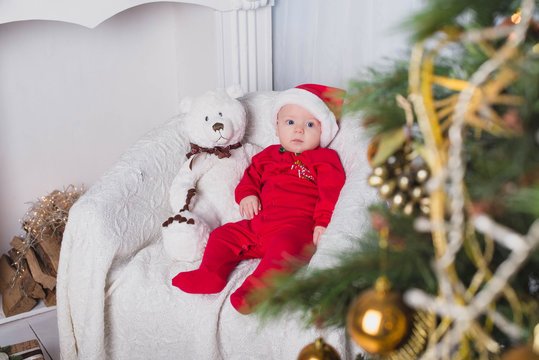Beautiful baby Christmas photo shoot- studio photo. Little santa. Happy New Year .