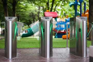 Pedestrian access control flap barriers, with card readers as security access controls to prevent unauthorized access to the school.
