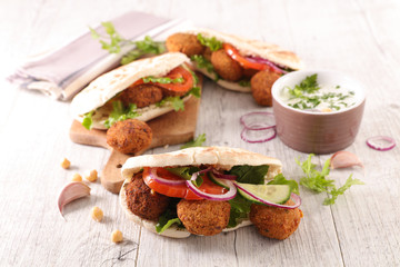 sandwich with falafel and sauce