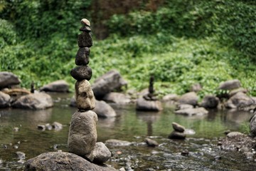 Fototapeta na wymiar Stone balancing on the banks of the river.