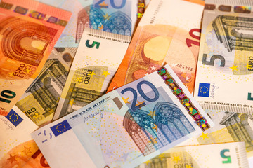 Pile of paper euro banknotes.