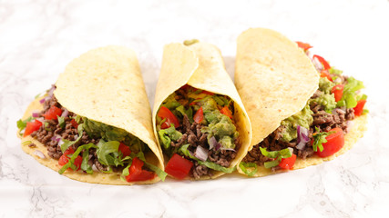 tortilla with minced beef, avocado and tomato