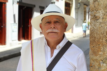 Elderly latino man looking at camera