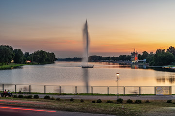 Naklejka premium Belgrade, Serbia - 20 June, 2018: Lake and geyser by sunset Ada Ciganlija - Belgrade