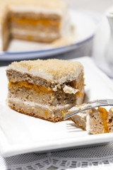 piece of cake with cream and jam, vertical closeup