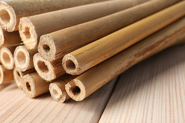 Pile of dry bamboo sticks on wooden table