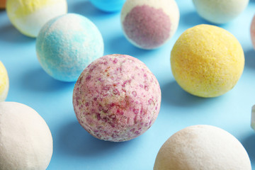 Many different bath bombs on color background