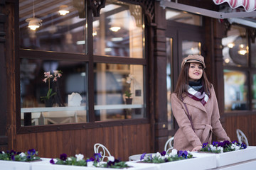 Young woman in a coat for a walk