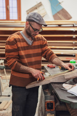 Carpenter man working in the workshop