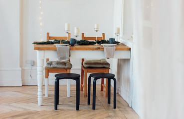 Festive table, minimalistic Christmas decor. Scandinavian interior