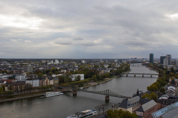 Fototapeta premium The view from the heights on the city skyline and the river main in Frankfurt