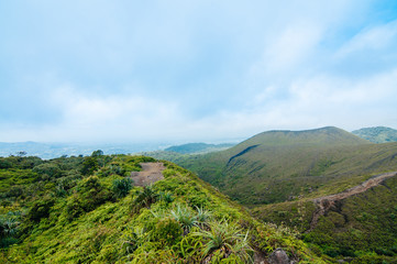 Obraz premium Green mountains and blue sky