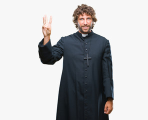 Handsome hispanic catholic priest man over isolated background showing and pointing up with fingers...