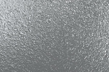 Crumpled metal foil grey background