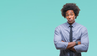 Afro american business man over isolated background skeptic and nervous, disapproving expression on face with crossed arms. Negative person.