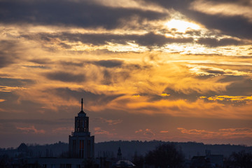 Fototapeta na wymiar Skyline of church tower during sunset
