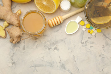 Various cold medicines and cold remedies on a white wooden table. Cold. diseases. cold. view from above