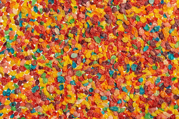 Fototapeta na wymiar background of colorful corn flakes. multicolored cereal on white background. flat lay, top view
