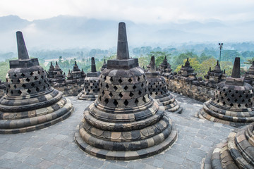 Sunrise among the stupas in Borobodur, a 9th-century Mahayana Buddhist complex in Magelang, Central Java, Indonesia