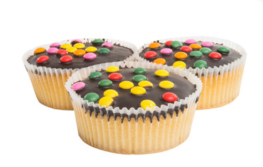 muffin with chocolate colored drops isolated