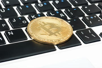 Bitcoin coin on keyboard