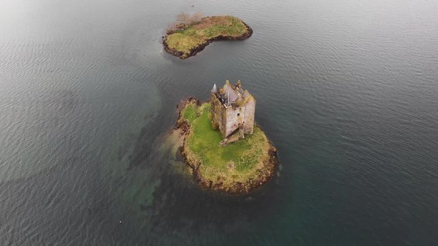 Aerial drone shot of Castle Stalker on tidal islet on Loch Laich in Scotland
