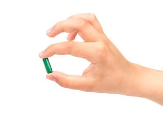 Green capsule in hand