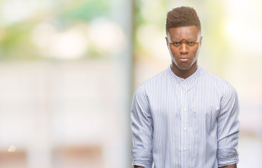 Young african american man over isolated background depressed and worry for distress, crying angry and afraid. Sad expression.