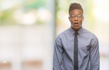 Young african american business man over isolated background afraid and shocked with surprise expression, fear and excited face.