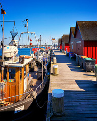 Fishing boats in the harbor Wei?e Wiek. Letters with Boltenhagen Fischereihafen means Boltenhagen fishing port.