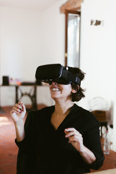 Woman using VR glasses for the first time