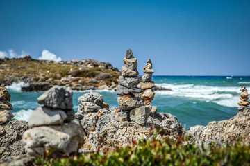 Pyramid of stones  on the sea and sky background