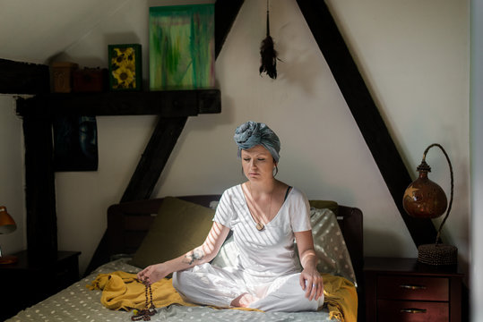 Woman doing kundalini yoga and chanting some mantra