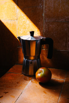 italian coffee maker and tomato