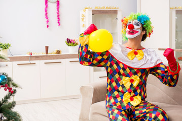 Fototapeta na wymiar Funny clown in Christmas celebration concept 