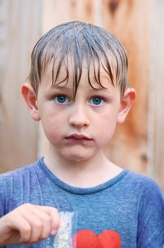 The unhappiest boy with a popsicle you've ever seen