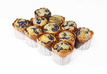 Delicious muffins on white background