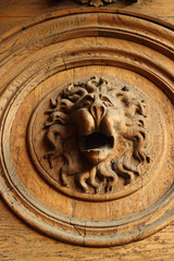 lion head, bas-relief, wood carving
