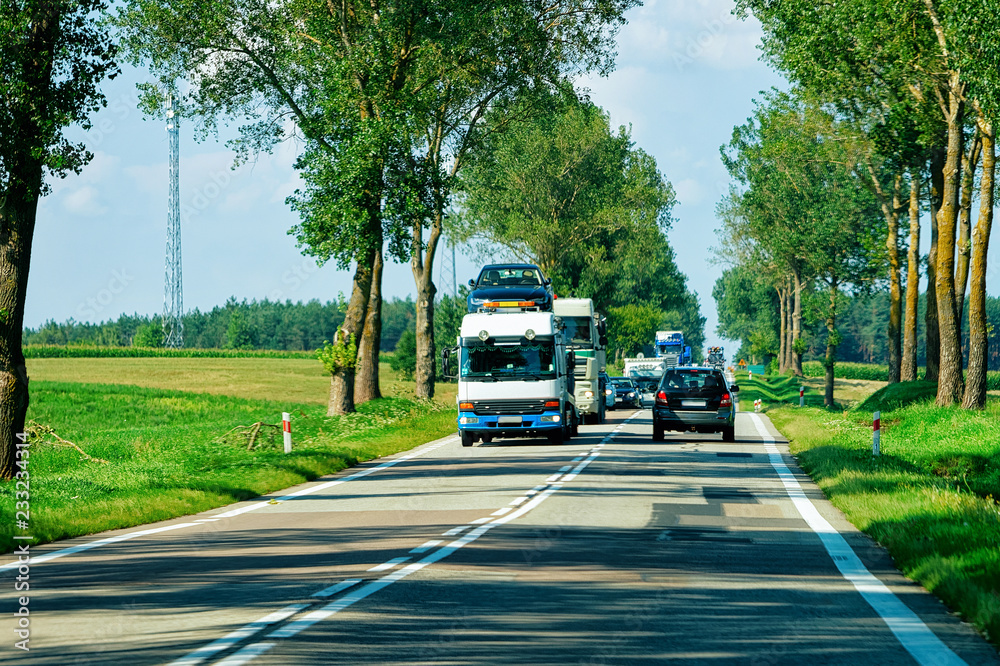 Wall mural cars carriers on road in poland