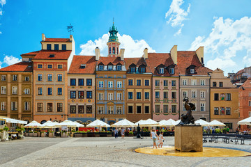 People at Syrenka statue in Old Town Market Square Warsaw