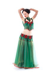 Fototapeta premium The girl in a green dress stopped at the dance