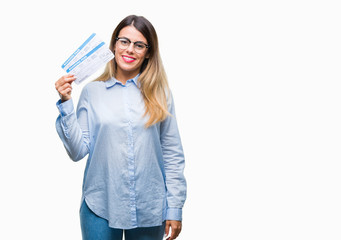 Young beautiful woman holding boarding pass over isolated background with a happy face standing and smiling with a confident smile showing teeth