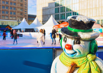 Snowman figurine at Skating rink on Christmas Market Alexanderplatz Berlin © Roman Babakin