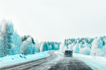 Car at winter road in Rovaniemi of Lapland in Finalnd