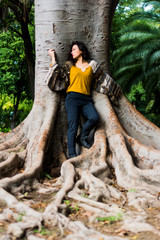Beautiful woman with brunette hair in the park