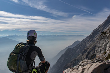 Fototapeta na wymiar Mountaineer viewing down to the Innvalley from a mountain called Hundkopf in the Karwendel Mountains, European Alps, Austria